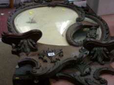 Pair of heavily carved and shaped wall/dressing table mirrors