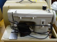 Cased Merritt electric sewing machine E/T