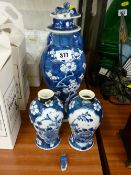 Four Oriental Prunus ware vases, two with covers (damages and restorations)
