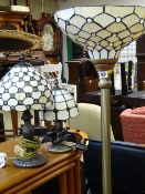 Modern brushed brass effect standard lamp and two similar table lamps, all with stained glass type