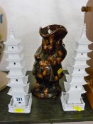 Pair of modern pottery pagodas and a treacle glaze snuff taker Toby jug (chipped)