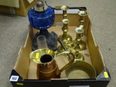Box containing iron based oil lamp with blue glass reservoir, two pairs of brass candlesticks etc