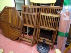 Octagonal garden table with folding chairs and metal based parasol