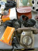 Vintage telephone, two sets of earphones, a cased pair of 10x50 binoculars, two leather cash