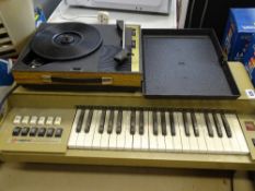 Vintage Magnus electric chord organ, model 2437 and a cased vintage Fidelity turntable E/T
