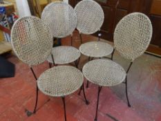 Set of four metal and woven work garden chairs