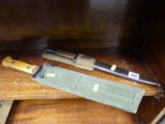 Military bayonet with scabbard and a military long bladed knife