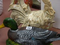 Heavy metallic duck doorstop and a pottery cockerel