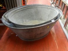 Two vintage galvanized tin baths