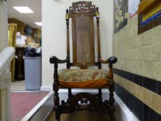 Continental walnut high back armchair with carved detail and canework back and seat (old worm