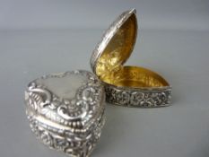 Pair of embossed heart shaped silver pill boxes, Birmingham 1899 with gilt interiors