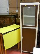 Vintage kitchen cabinet and a yellow twin flap formica top gate leg table