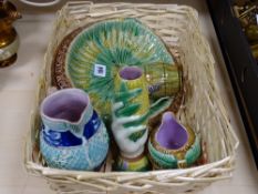 Wicker basket containing Majolica bread plate and similar items