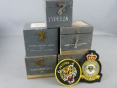 Five vintage wooden transit cases for compass instruments and two RAF 74th Squadron embroidered