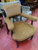 Edwardian ebonized salon armchair in a classical column style detail on brass cup and black pot
