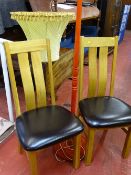 Pair of ultra modern high back oak and leather effect seated side chairs and a red stained