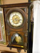 Vintage Continental pendulum wall clock, the enamel dial set with Roman numerals