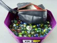 Collection of vintage glass marbles with a zip-up bag and a mid Century Eye Spy badge