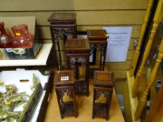 Two pairs and another larger of Oriental style fretwork hardwood ornament stands