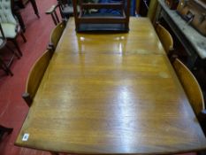 Set of five G-Plan Danish design teak dining chairs and an extending crossbanded teak dining table