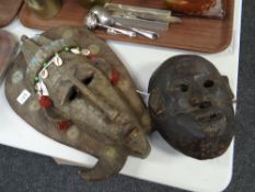 Two carved wooden grotesque native-arts tribal masks Condition reports provided on request by