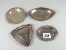 Four various hallmarked English silver pin dishes of various sizes, shapes and decoration to border,