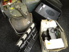 A vintage hand held Eumig 824 camera & clapper board together with a Novamat slide projector ETC