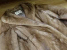 A ladies short mink fur jacket, retailed by Faulkes, Edgbaston, Birmingham together with original