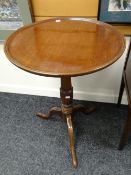 An antique circular oak topped wine / side table on tripod base Condition reports provided on