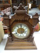 A vintage carved table clock Condition reports provided on request by email for this auction