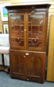 Antique mahogany astragal glazed top standing corner cupboard with two-door cupboard base