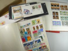 A blue, brown & red modern album of mainly British & Commonwealth stamps together with a boxed