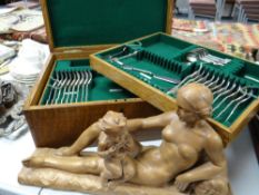 A vintage oak encased part canteen of cutlery & a composition sculpture Condition reports provided