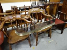 Two smokers-bow elbow chairs, a Chippendale-style elbow chair and a brass fender Condition reports