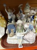 A Lladro group of children reading, a Lladro group of a boy teasing a girl with a ball, a Lladro