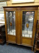 Edwardian inlaid mahogany display having swag and bow decoration, raised on stile-type feet,