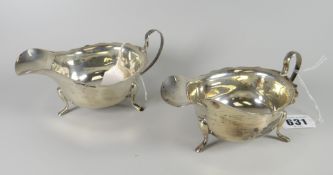 A pair of silver sauce boats with rims and loop handles on three-pad feet, 6.8oz Condition