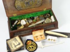 A vintage carved wooden box containing large quantity of intriguing collectables, militaria, coins &