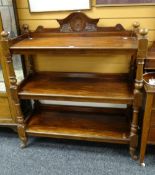 Late nineteenth / early twentieth century mahogany three-tier dumbwaiter raised on ceramic castors