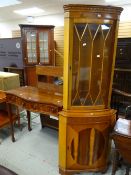 A reproduction serpentine hall table and a yew effect semi-glazed corner cabinet Condition reports