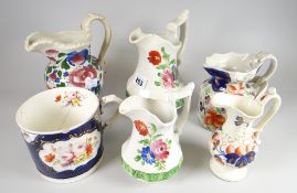A pair of graduated Swansea floral jugs, an antique floral painted oversized mug (damage) ETC