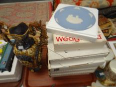 A parcel of carved souvenirs, ornamental metal fruit & flower ornaments, collector's plates ETC