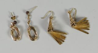 A pair of 9ct gold earrings of abstract form with suspended pegs together with a pair of yellow