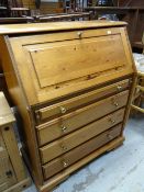 Modern pine full front bureau having fitted interior above four drawers, 91cms wide x 111cms high
