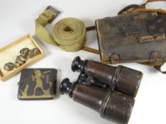 A pair of early twentieth century Bloom Ltd binoculars, a military belt, Egyptian cigarette case ETC
