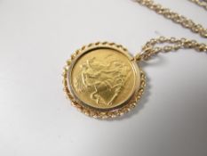 A 1899 half gold sovereign mounted to fine yellow metal necklace Condition reports provided on