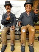 Large novelty ornament of Laurel & Hardy sitting on a metal bench Condition reports provided on