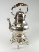 A Goldsmiths & Silversmiths Company silver spirit kettle and stand, the kettle of faceted pear
