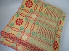A good traditional Welsh wool blanket with mustard ground and red, green and turquoise geometric