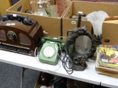 An unusual vintage switch-board telephone, a vintage domestic telephone, a pair of metallic vases,